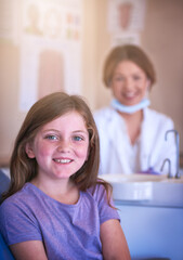 Dentist, child and portrait with doctor for oral hygiene or cavity treatment for teeth cleaning or...