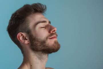 Obraz premium A close up of a man with beard and closed eyes looking to a side