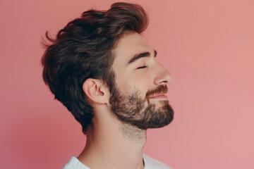 Obraz premium A close up of a man with beard and closed eyes looking to a side