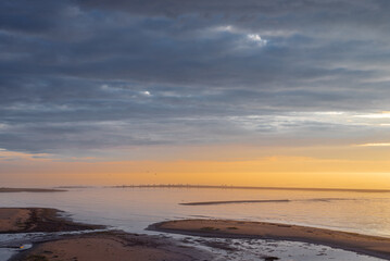 Baltic sea covered with fog after rain during the sunset at summer