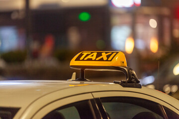 Illuminated yellow Cypriot taxi sign