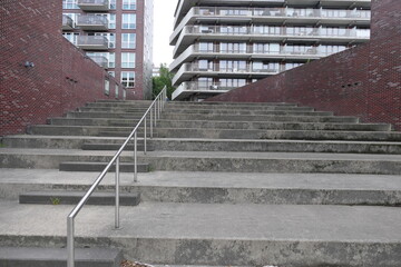 two apartment buildings with concrete stairs in Amsterdam