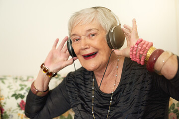 Elderly woman, portrait and headphones in home with music for retirement, audio playlist and...