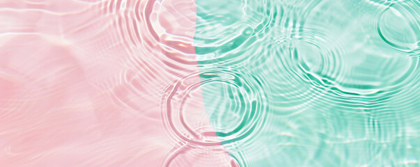 Obraz premium turquoise mint pink Water surface with gentle ripples and concentric rings, capturing the serene and refreshing essence of calm water