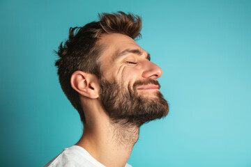 Obraz premium A close up of a man with beard and closed eyes looking to a side