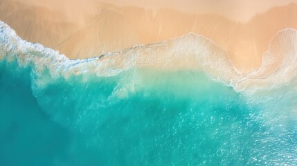 Fototapeta premium bird's eye view of golden sandy shores meeting turquoise ocean waters