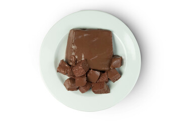 Pork Blood Pudding or Congealed Pork Blood or Pig Blood Curd whole and sliced in a white plate isolated on white background with clipping path, top view, flat lay.