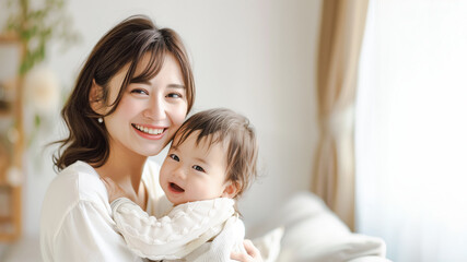 赤ちゃんを抱っこするママ