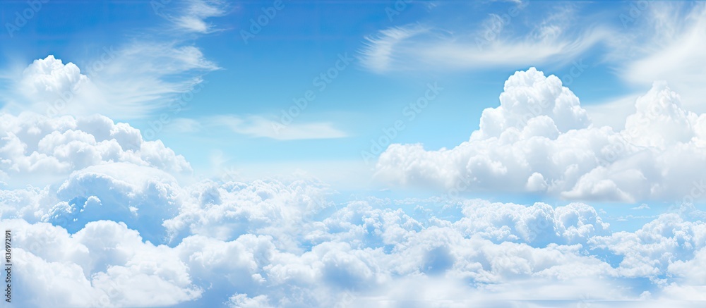 Poster abstract style panorama with a backdrop of blue sky, white clouds, and copy space image.