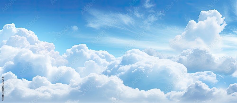 Aufkleber Image of a vibrant blue sky with fluffy clouds providing a copy space image for customization.