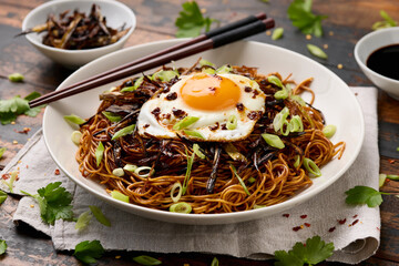Scallion Oil Noodles with fried egg on top and chilli oil