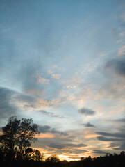 Beautiful spectacular sunset in the sky. Bright colors. The state of the sky before the storm