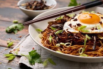 Scallion Oil Noodles with fried egg on top and chilli oil