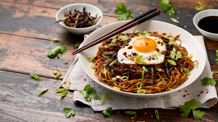 Scallion Oil Noodles with fried egg on top and chilli oil