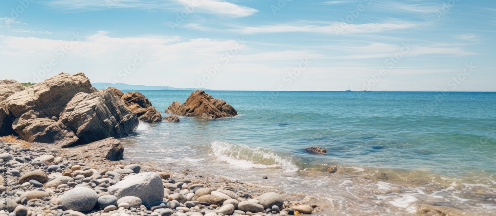 Poster seaside landscape with rocks on shore, perfect for a copy space image.