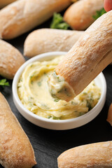 Stone baked ciabatta bread sticks with creamy garlic butter dip.