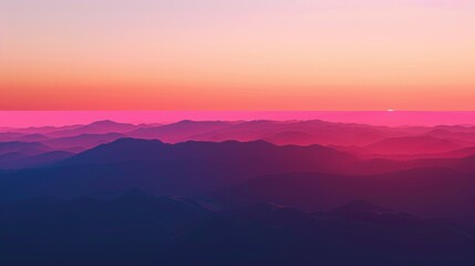 Stunning Pink and Purple Mountain Range at Sunset With Hazy Horizon and Dramatic Sky