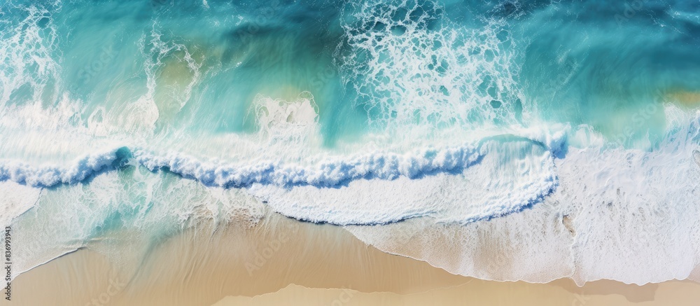 Poster coast with waves as a background from top view blue water background from drone summer seascape from