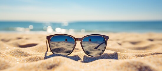 sunglasses on the beach in summer day. Creative banner. Copyspace image