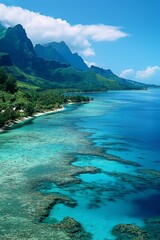 Tranquil coastal scene with lush mountains, turquoise sea, and vibrant coral reefs.