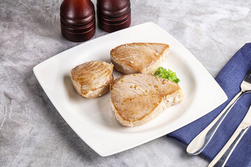 Roasted red tuna steak in the plate