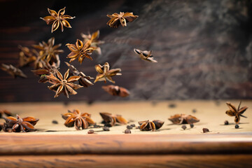 Obraz premium star anise on wooden table