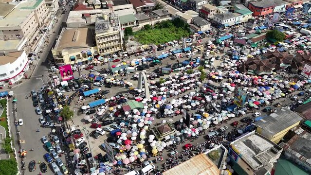 Lots of people and cars at Accra Central Market Makola, Ghana