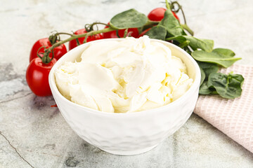 Soft cream cheese in the bowl