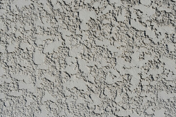 Detailed view of a textured wall with intricate rough patterns