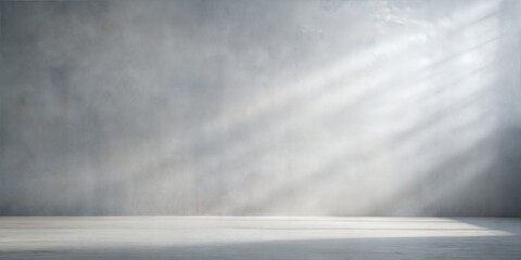 Soft Grey Blur: A minimalist soft grey blurred background with gentle shadows on the floor and wall, perfect for a modern product display.
