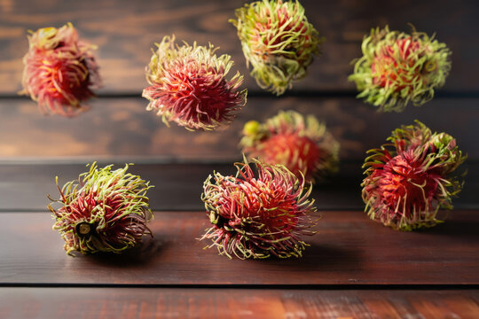 rambutan fruits on wooden table