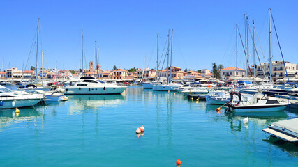 Fototapeta premium Photo of a wide range of yachts of various sizes docked at Aegina Marina in Greece.
