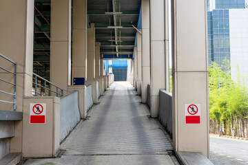 Car ramp leading up to a parking deck