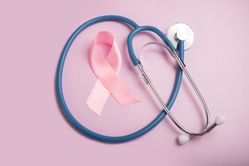 breast cancer treatment, ribbon and stethoscope on pink background, awareness month prevention...