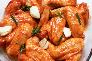 Marinated roast a spicy chicken wings with garlic and rosemary.