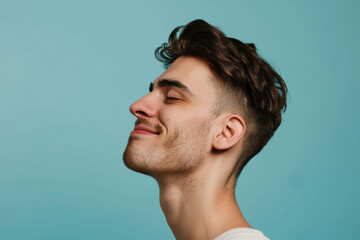 Fototapeta premium A close up of a man with beard and closed eyes looking to a side