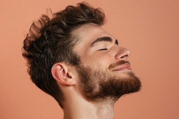 Obraz premium A close up of a man with beard and closed eyes looking to a side