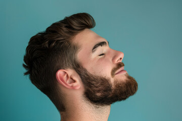 Obraz premium A close up of a man with beard and closed eyes looking to a side