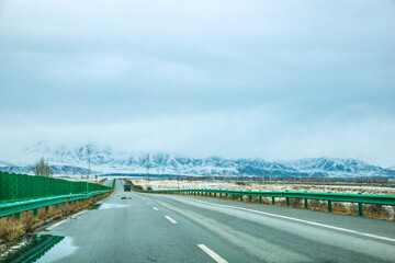 Haixi Mongolian and Tibetan Autonomous Prefecture, Qinghai Province - Meadow Road under Snowy Mountains