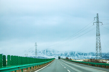 Haixi Mongolian and Tibetan Autonomous Prefecture, Qinghai Province - Meadow Road under Snowy Mountains