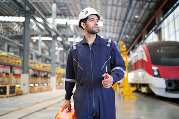 Technician or engineer holding tool box for fixing the train at construction site