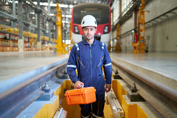 Technician or engineer holding tool box for fixing the train at construction site