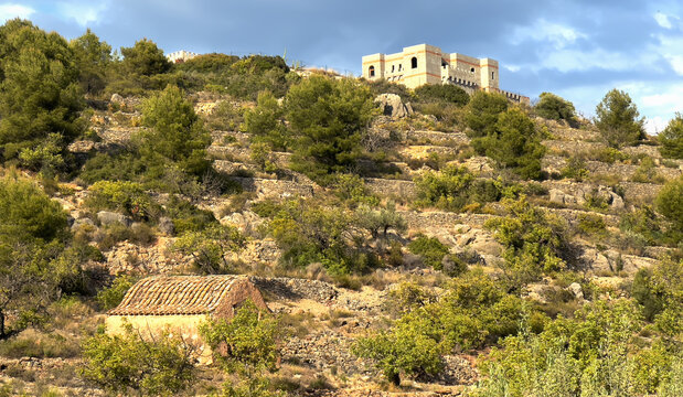 Castle on the mountain. Muslim fortress on a hill and a Spanish village of Cam&iacute; de Casanya, 12600 Almenara, Castell&oacute;, Spain