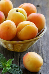 fresh organic apricots on wooden table