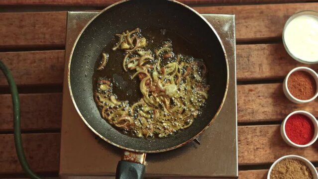 onion frying by garlic ginger turmeric, chilly powder
