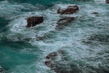 waves breaking on rocks
