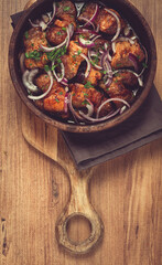 fried meat, pork kebab, ketsi in a clay pan, with red onions and herbs, homemade, no people,
