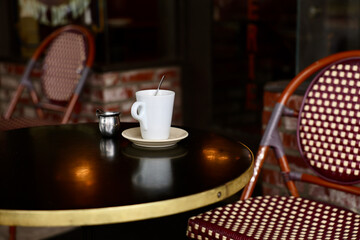 empty coffee cup on a bistro table