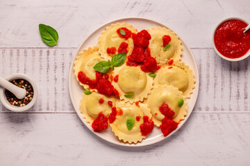 Ravioli with tomato sauce and basil