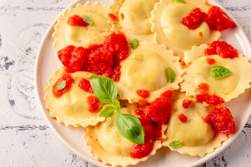Ravioli with tomato sauce and basil